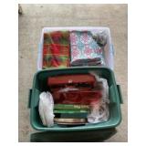 Two totes of Christmas dishes and decor.