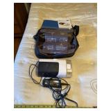 ResMed sleep apnea machine with cord.