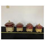 Red to yellow drip glaze pottery canisters.