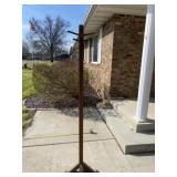 Tall wood coat hanger.