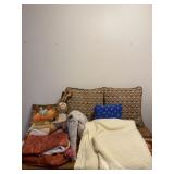 Pillows, blankets, stuffed animals and bed skirt