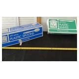 New not full boxes of plastic spoons and knives.