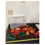 Plastic cookie cutters with tote and lid.