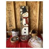 Wood snowman sign, tins and basket with pine