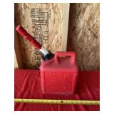 1 gallon gas jug over half full.