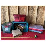 Totes with lids full of ornaments and Christmas