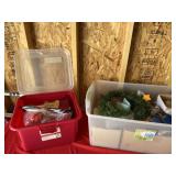 Two totes with lids and Christmas decor.