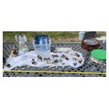 Two totes with lids and Christmas decor and tins.