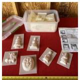 Tote with lid and plastic molds.