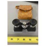 Japanese vest pocket binoculars in leather case.