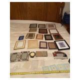 All picture frames on bed.