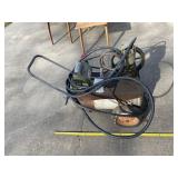 Air compressor with hose and hard tires.