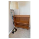 3 shelf bookcase and floor lamp