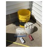 Golf balls, Teeï¿½s and bucket.