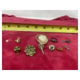 Religious lapels, Mackinac Island, bicycle charm