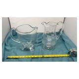 Large three footed pitcher with handle and etched