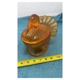 L. E. Smith golden Amber turkey on a nest.