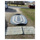 54 inches x 97 inches oval rug with stains and