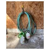 Garden hose, water jug and hand sprayer