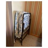 Fold up iron twin bed.