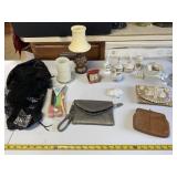 Purses, combs, lamp and everything on table.
