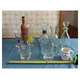 Empty Bourbon decanter, mugs and glasses.