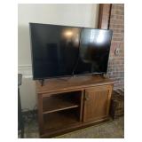 Vizio 50 inch flat screen tv and wood cabinet