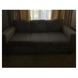 Grey contemporary three seat sofa measures 83
