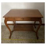 Cherry wood and able with single drawer that has