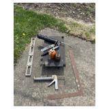 Levels, grease guns, oil cans, t square and cart