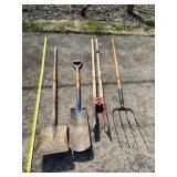 Spade, pitchfork and post hole digger.