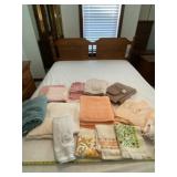 All Bathroom towels on bed.