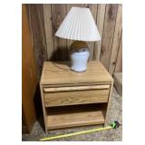 Top drawer night stand and lamp.