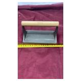 Cast iron bacon press with wooden handle pig on