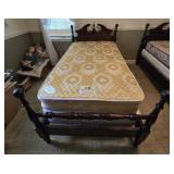 Dark Wood Bed Frame with A Twin-Sized Mattress