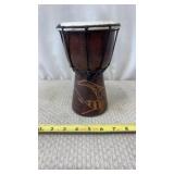 Hand Carved African djembe drum featuring a