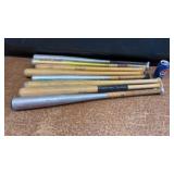 Various baseball and softball bats.