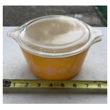 Pyrex Butterfly Gold casserole dish with a clear