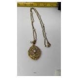 1928 Jewelry Company gold tone locket necklace