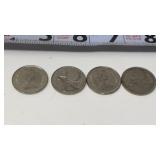 Canadian quarters, featuring a profile of Queen