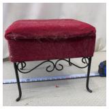 Wrought-iron footstool with a red upholstered