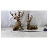 Pair of gold resin deer figurines decorated for