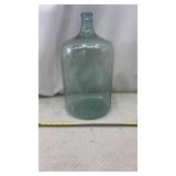 5-gallon aqua glass carboy or demijohn water jug.