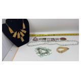 Costume jewelry features a variety of beaded and