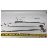 Silver-tone costume jewelry necklaces featuring