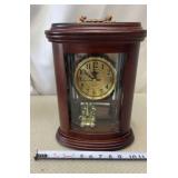 West Manor quartz mantle clock with a revolving