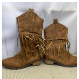 Brown faux leather boots featuring tassel fringe