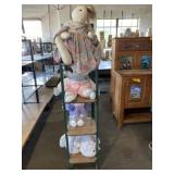 Wood Shelf 57 Inches Tall with Stuffed Rabbits.