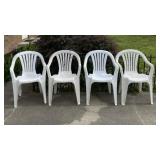 Four White Plastic Chairs