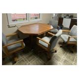 Wood T table with Four Cushioned Chairs on Wheels